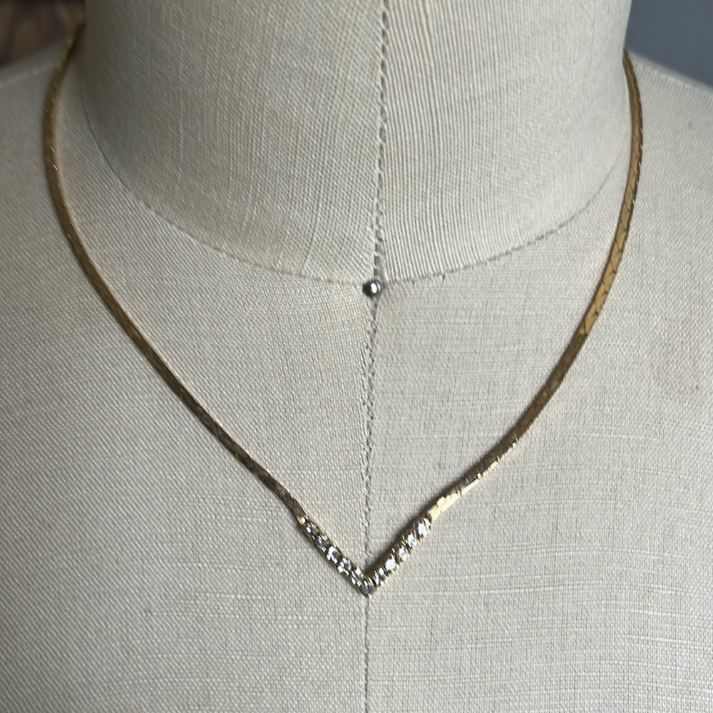 Gold-tone necklace with V-shaped faux diamonds